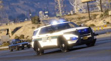 a sheriff 's car is driving down a highway