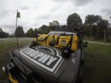 a jeep with rainforest trophy written on the front