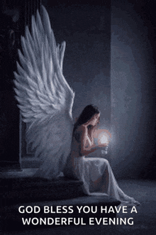 a woman with angel wings is sitting on a staircase holding a candle and a light .