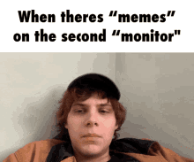 a picture of a man with the caption when theres " memes " on the second monitor