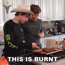 a man in a cowboy hat is standing next to another man in a kitchen with the words " this is burnt " above them