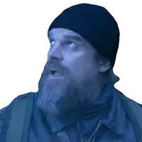 a man with a beard wears a black hat