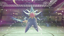 a purple and white star with a red center is surrounded by confetti