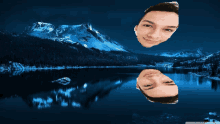 a reflection of a man 's face in a lake