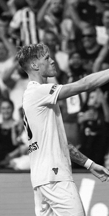 a black and white photo of a soccer player with the number 1 on his shirt