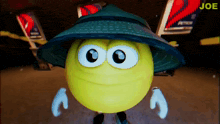 a cartoon smiley face wearing a hat and gloves with the word joe behind it