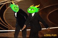 two men in tuxedos with green masks on their faces standing next to each other with the words long fun below them