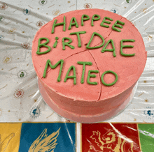 a pink cake that says happee birtdae mateo on it