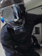 a person wearing a helmet with a gopro camera attached