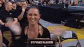 a woman with the name stephanie mcmahon on a chair