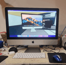 an apple computer is on a desk with a blue mouse