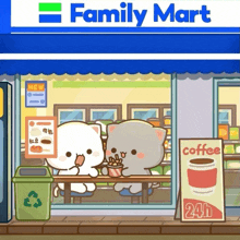 two cats are sitting at a table in front of family mart