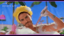 a man is taking a bath with a yellow hat on