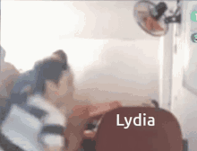 a blurred image of a person with lydia written on the bottom