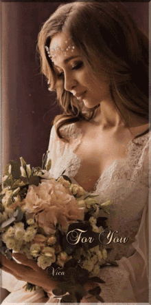 a woman in a white lace dress is holding a bouquet of flowers with the words " for you " on the bottom