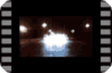 a film strip with a blurry picture of a light coming out of the bottom of the screen .