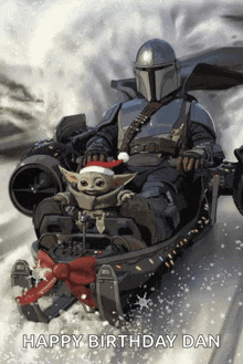 a happy birthday card with a mandalorian and a baby yoda on a sled