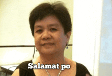 a woman is wearing a black top and a necklace with the words salamat po written above her