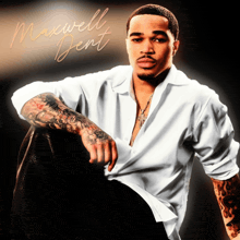 a man in a white shirt with the name maxwell dent written on the bottom