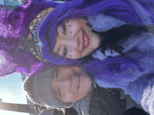 a woman wearing a purple wig with the word ravens on her head