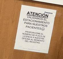 a sign that says atencion is taped to a wall