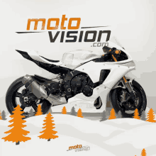 a white motorcycle is on display in front of a moto vision logo