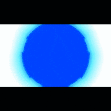 a blue circle with a light coming out of it on a white background .