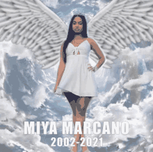 a picture of a woman with angel wings and the name miya marcono 2002-2021