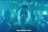 a man is dancing in a dark room with the words goodvibewishes below him