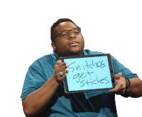 a man holding a tablet that says snitches get stitches on it