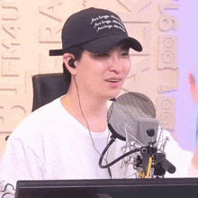 a man wearing a black hat that says ' are grappler ' on it