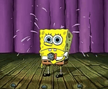 spongebob squarepants is holding a microphone on a stage .