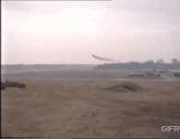 a gif of a plane taking off from a field