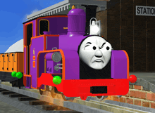 a purple and red train is sitting in front of a station sign