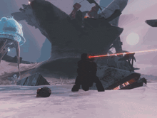a person is kneeling down in the snow with a red light coming out of their eyes