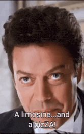 a close up of a man 's face with the words `` a limousine ... and a pizza '' written on it .