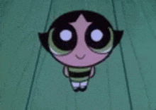 buttercup from the powerpuff girls is sitting on a wooden floor with her eyes closed .