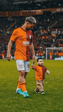 a soccer player with the number 10 on his jersey is walking with a little boy