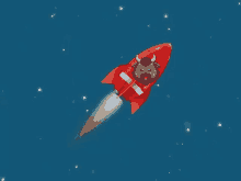 a red rocket with a bull on it is flying through the air .