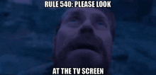 a man with a beard is looking up at the sky with a caption that says rule 540 please look at the tv screen