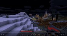 a screenshot of a video game called minecraft showing a snowy mountain