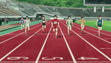 a group of athletes are running on a track and one of them has the number 524 on his jersey