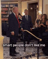 donald trump speaking into a microphone with the words smart people don 't like me behind him