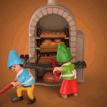 two playmobil gnomes are working in a bakery