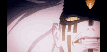 a close up of a person 's face with yellow eyes and fangs