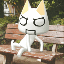 a white cat with a yellow ear is sitting on a bench