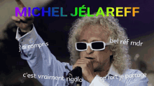 a man wearing sunglasses is singing into a microphone with the name michel jelareff written above him