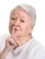 an elderly woman is making a silly face with her hand on her chin .