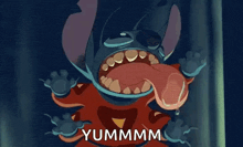 a close up of a cartoon character with a big mouth and the words yummmm written below it .