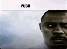 a close up of a man 's face with the words fuck above him